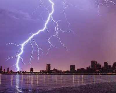 City lit up at night. Photo by Andre Furtado on Pexels